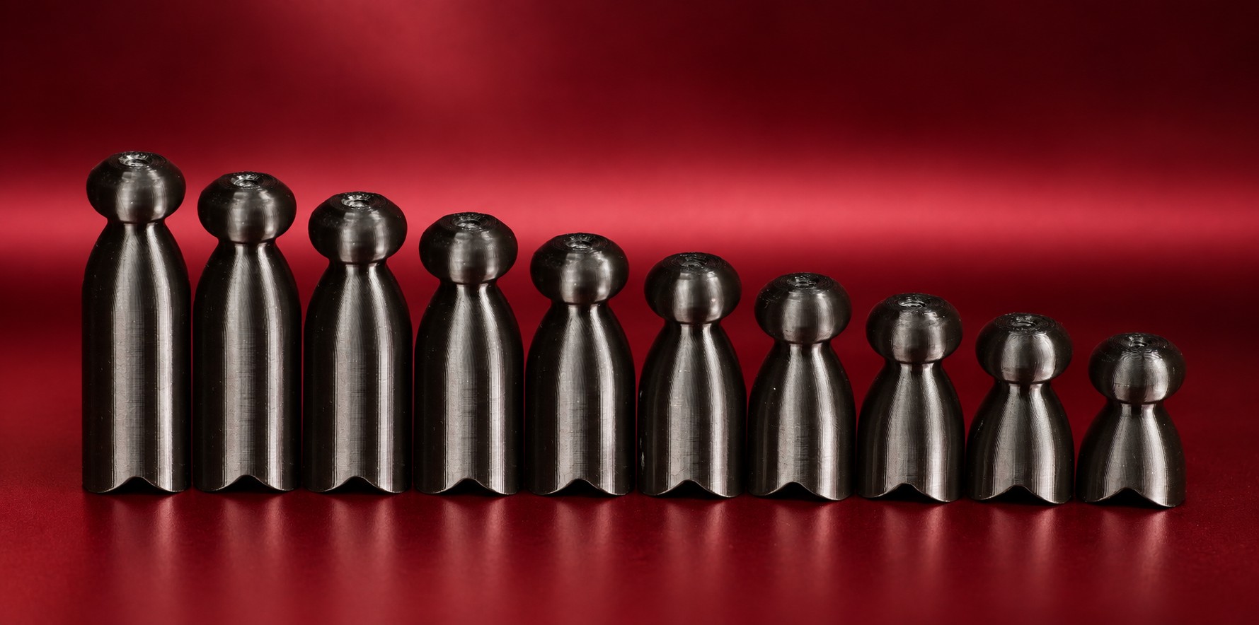 Ten P-tainers lined up from longest to shortest, showing the range of body lengths available.