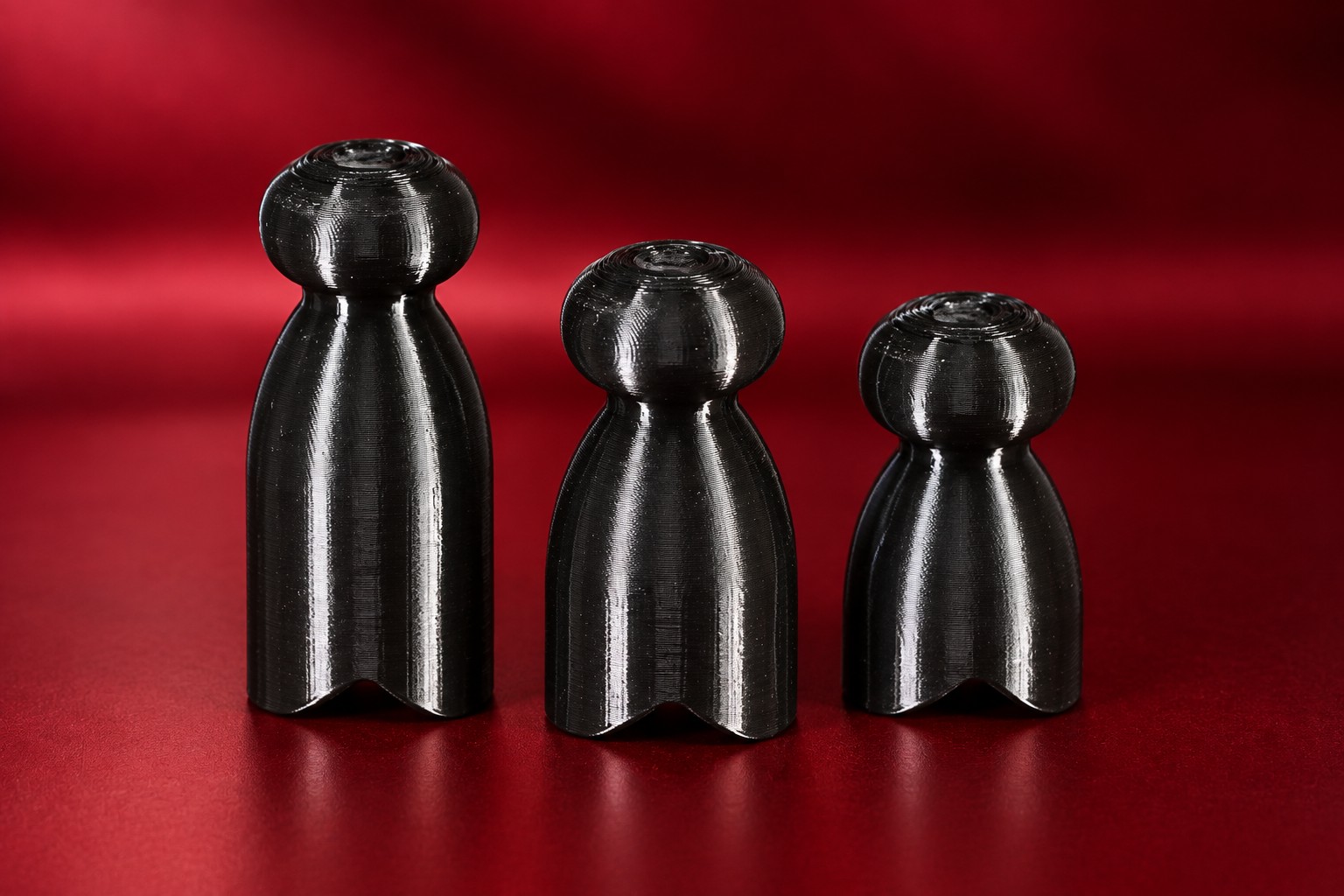 Three demo P-tainers of the same diameter in different lengths, side by side.