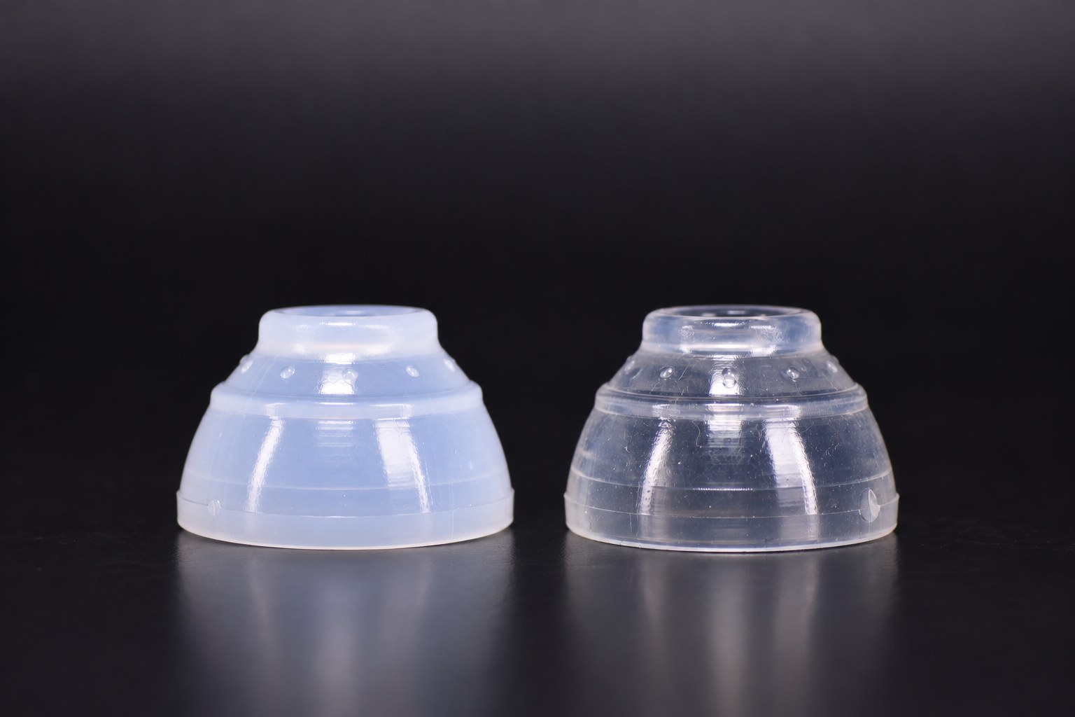 Snug-Fit Soft gripper on the left and Comfort-Fit Stiff gripper on the right, both included in the kit.