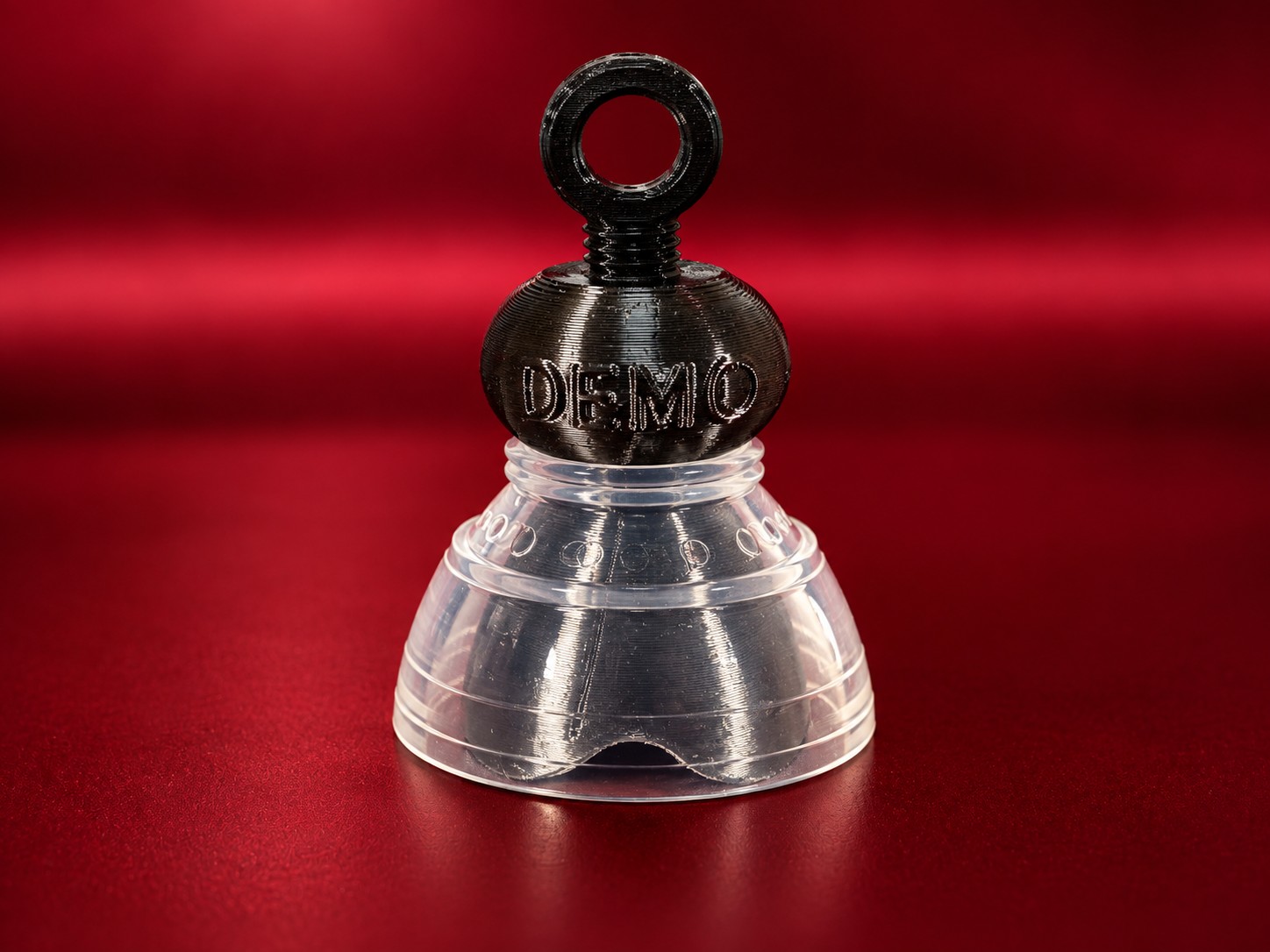 A demo P-tainer with a gripper fitted and the Plastic Tugging Ring screwed into the threaded knob end.