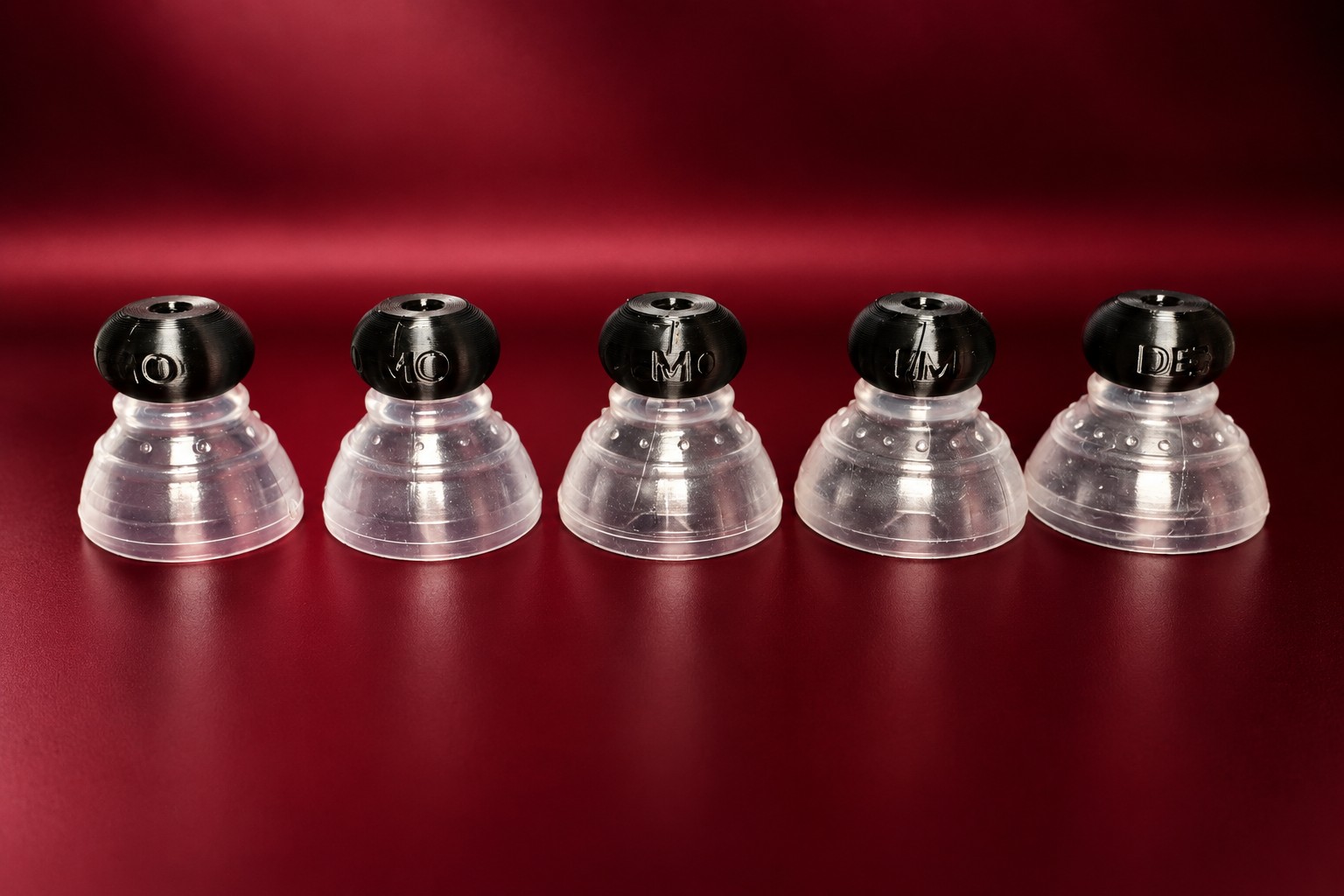 The five demo P-tainers with matching stiff silicone grippers fitted.