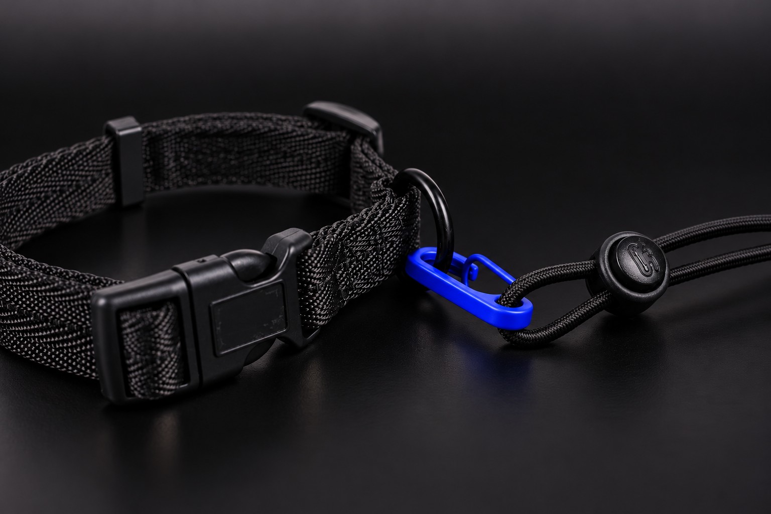 Leg Cincher (black dog-collar-style strap) with the Shocker strap clipped to its leash ring.