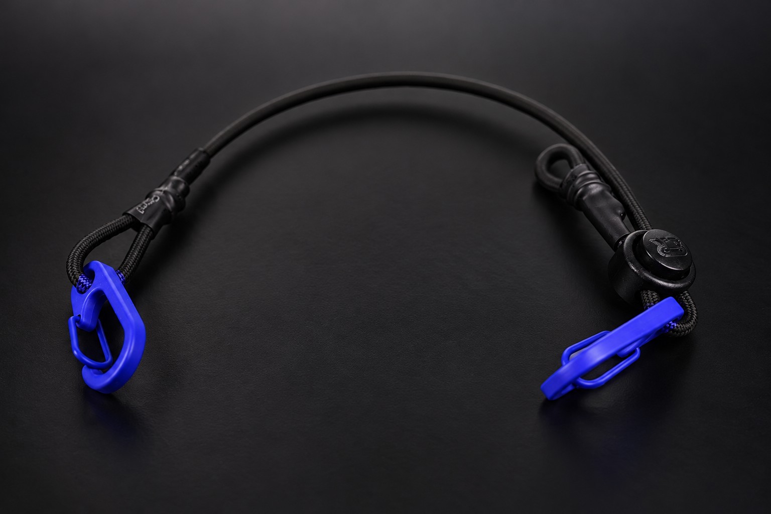 TLC Shocker Shorty Strap: one foot of black elastic shock cord with blue clips on both ends and a cord lock.