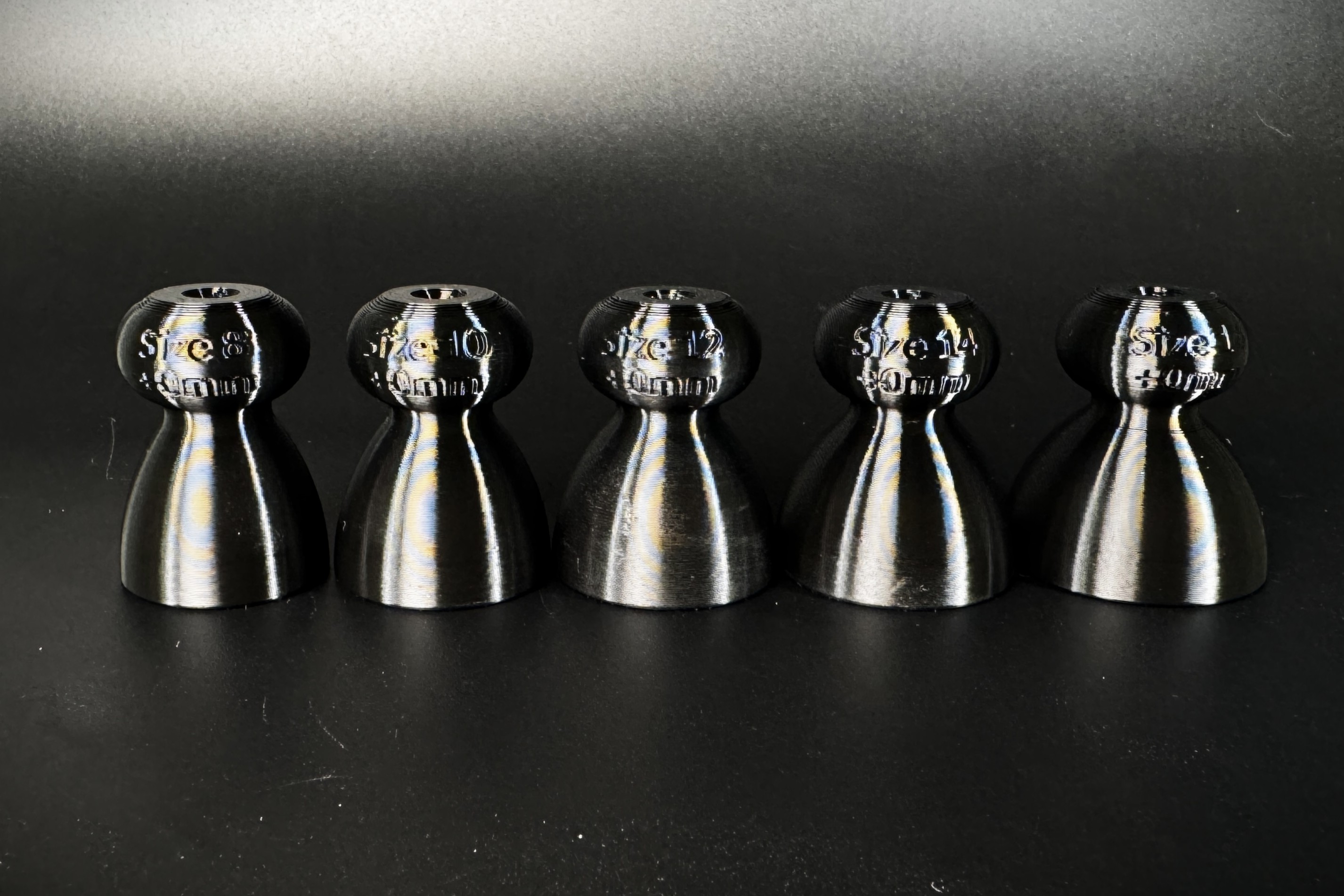 The five demo P-tainers in ascending size, each labelled Size 8 through 16.
