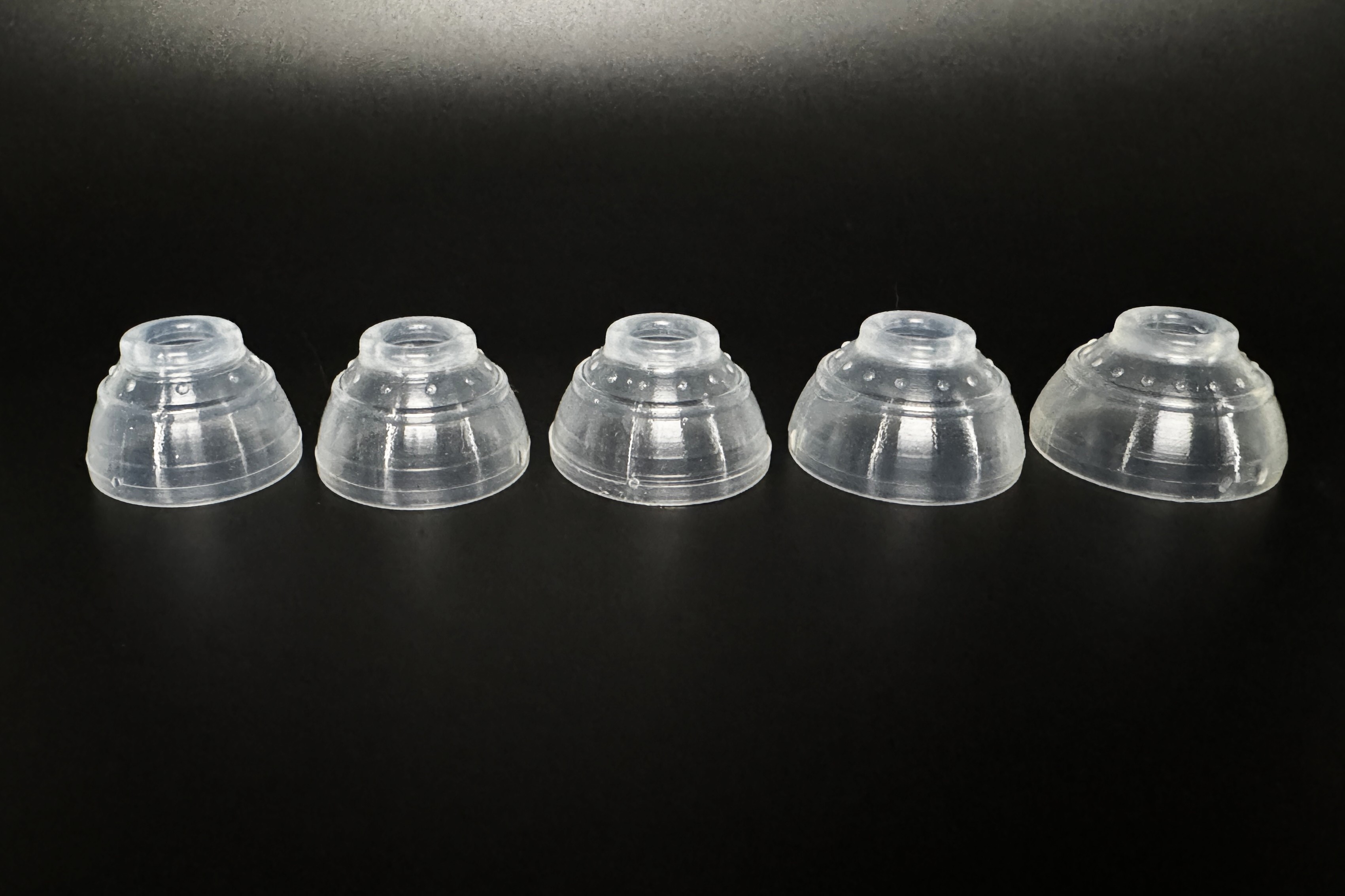 The five stiff silicone grippers included in the kit.