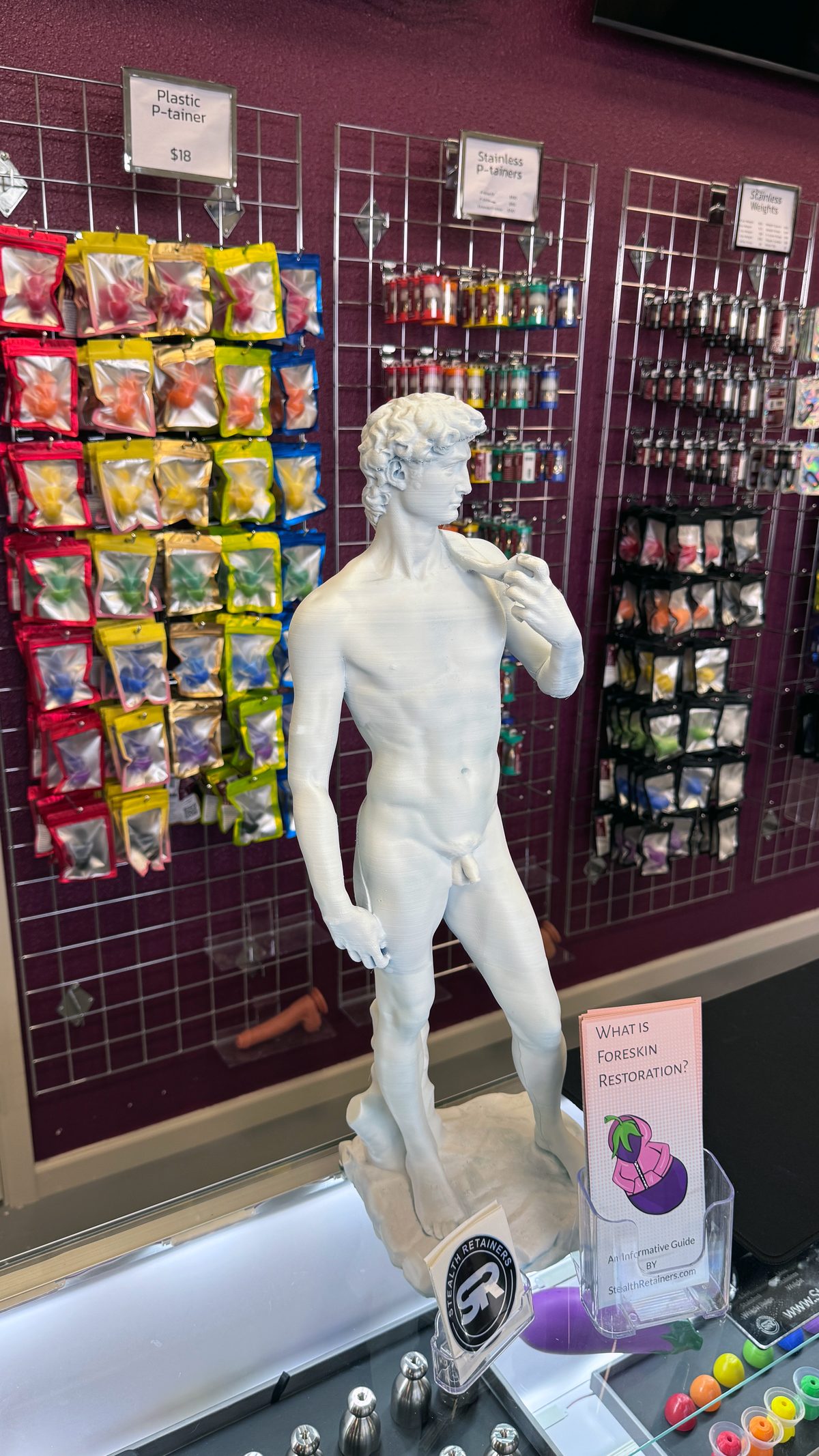 The David statue centerpiece with products on display